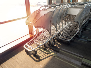 Airport luggage cart in airport.