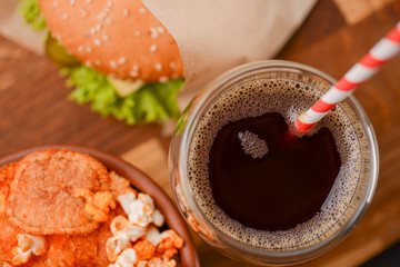 Tasty and appetizing hamburger on a darkly green background