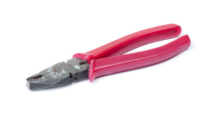 Old pliers with red handle