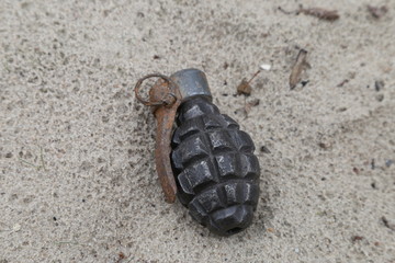 old grenade f-1 in the sand