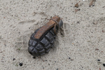 old grenade f-1 in the sand