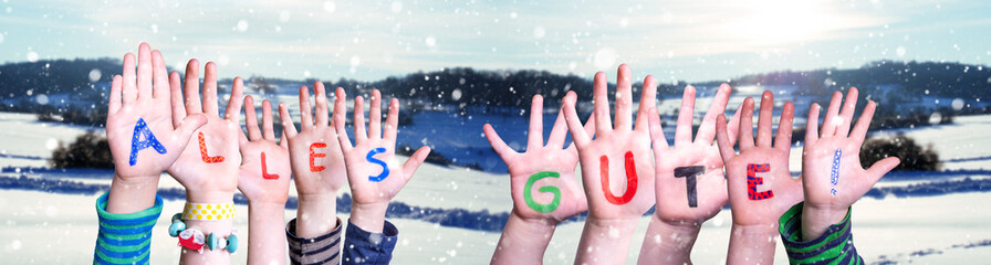 Children Hands Building Colorful German Word Alles Gute Means Best Wishes. Snowy Winter Background With Snowflakes