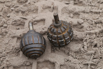 World War I hand grenade in the sand