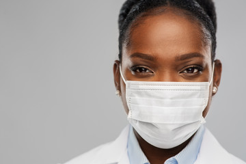 medicine, profession and healthcare concept - close up of african american female doctor or...