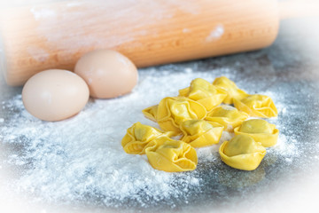 close up of homemade raviolis made from eggs, wheat flour filled with cheese and spinach vegetable for vegan.