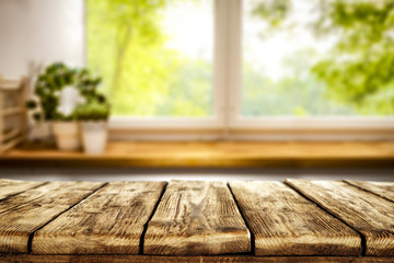 Desk of free space and blurred window background 