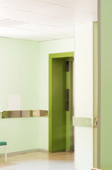 Elevator shot in hospital corridor, green color