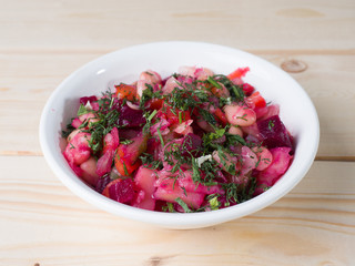 Russian beetroot salad Vinigret in a bowl. Side view
