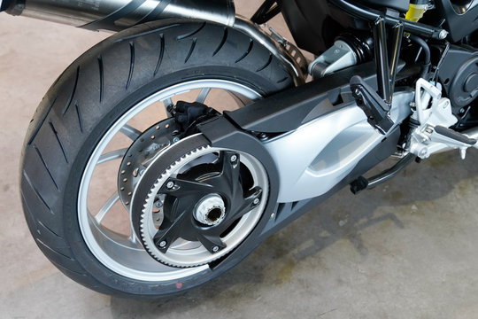rear wheel of a new bmw motorcycle with belt transmission in Motorrad motorbike dealership motorcycle
