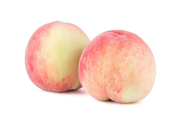 Fresh peach isolated on white background.