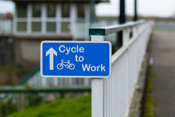 Cycle to Work Sign attached to Metal Railings - obrazy, fototapety, plakaty