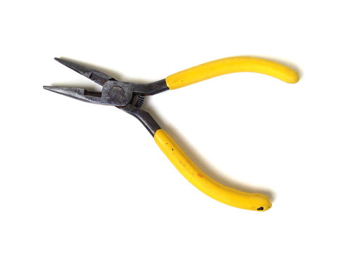 Close up of electrical pliers isolated on white background. Yellow handle pliers. Hand tool.