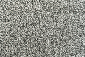 Light grey grunge asphalt texture close up view. 