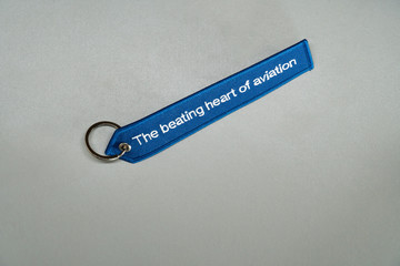 Blue remove before flight airplane label with white text slogan on it isolated on white background...