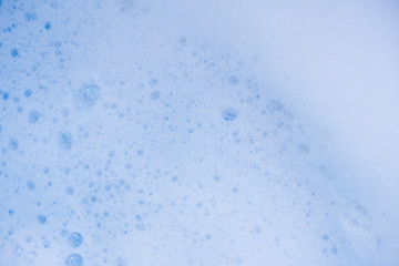 Abstract background white soapy foam texture. Shampoo foam with bubbles