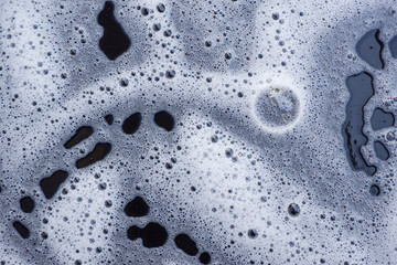 Abstract background white soapy foam texture. Shampoo foam with bubbles