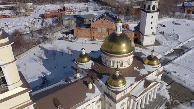 Flying over the Nevyansky Leaning Tower and the Transfiguration Cathedral. View from above. City Nevyansk. Russia