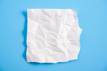 Obraz premium white torn paper with blue background, ready for design