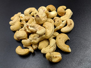 rosted cashew on black textures background