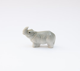 Miniature porcelain rhinoceros - isolated on white background