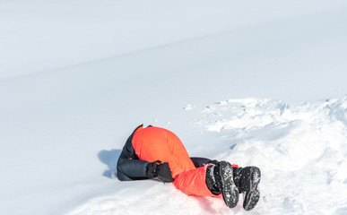 girl landing with her head on the fresh snow
