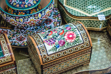 Close up on a decorated wooden and ivory boxes in souvenir shop in Shiraz, Iran
