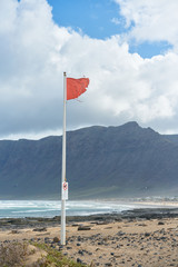 red flag on the beach