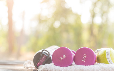 healthy lifestyle, food, sport or athlete's equipment on bright background. copy space. healthy eating, dieting, slimming and weigh loss concept - close up of green apple, measuring tape and fruit.