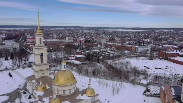 Flying over the Nevyansky Leaning Tower and the Transfiguration Cathedral. View from above. City Nevyansk. Russia