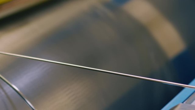 Silver, Platinum Metal Rolling Process at factory of precious Metal Production, Industrial, Tracking, Close Up