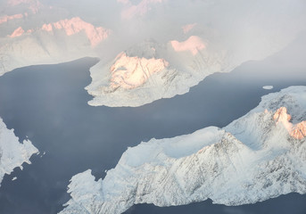 Aerial view of snow covered mountains and fjords in East Greenland, Maniitsoq