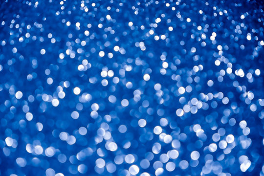 blue navy background glitter silver christmas texture abstract light glittering stars on bokeh. glitter vintage lights background