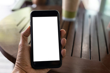 man hand using smartphone In the coffee shop,Screen blank