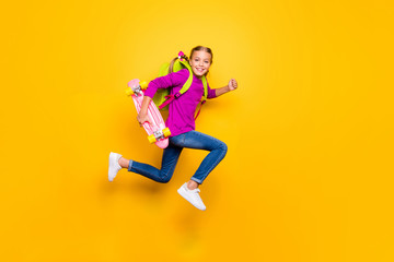 Fototapeta na wymiar Full length body size view of her she nice attractive glad purposeful cheerful cheery girl jumping running carrying longboard having fun isolated on bright vivid shine vibrant yellow color background
