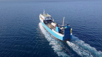 Obraz premium Ro Ro Ship: Aerial view of a medium RoRo Vehicle carrie vessel cruising at sea.