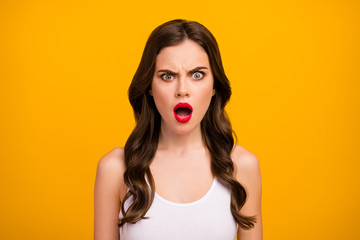 Closeup photo of funny pretty lady open mouth displeased facial expression listen bad news terrible situation wear white tank-top isolated bright yellow color background