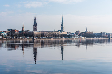 Cityscape of Riga Latvia with Reflections on a Quiet Still River