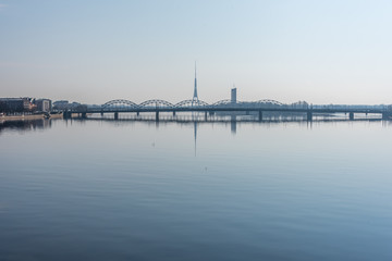 Obraz premium Cityscape of Riga Latvia with Reflections on a Quiet Still River