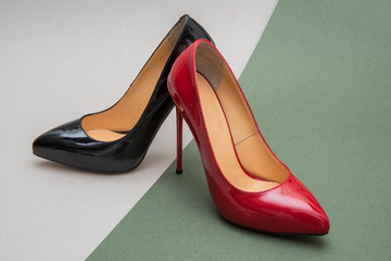 red and black female shoes stiletto