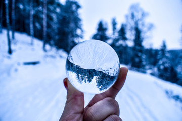 Glass ball in the winter nature