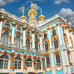 Fototapeta na wymiar A fragment of the facade of the Catherine’s Palace in the city of Pushkin near St. Petersburg, richly decorated with stucco molding