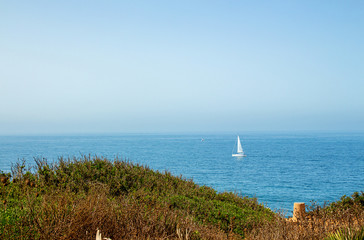 Atlantic ocean, spanish seashoore, yacht on horizon. Beauriful seascape