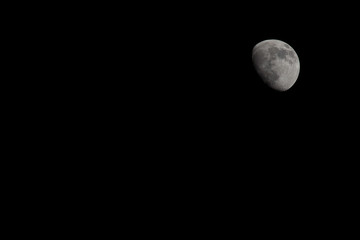 Closeup of a Three Quarter Moon in a Black Sky