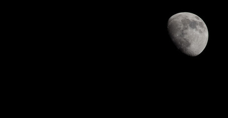 Closeup of a Three Quarter Moon in a Black Sky