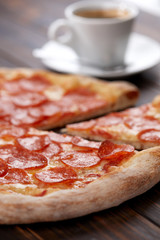 tasty pizza on the wooden background