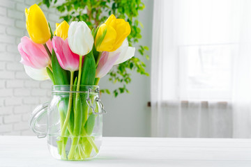 Bouquet of fresh flowers on a table, close up