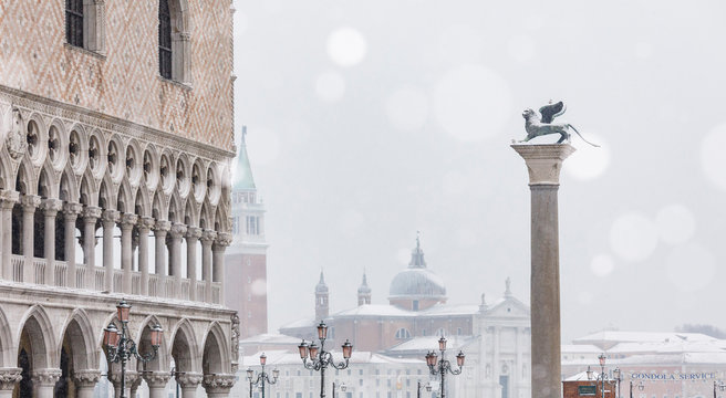 Rooftops of old buildings including Doge's Palace, Lion of Saint Mark and church of San Giorgio Maggiore. Piazza San Marco, Venice, Italy