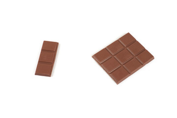 pieces of dark milk chocolate bar isolated on white background.