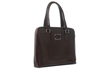 Naklejka premium leather female brown bag on the handle sideways on a white background