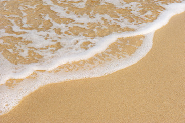Fototapeta na wymiar Brown Sands beach and clear water sea with soff waves breaking coast
